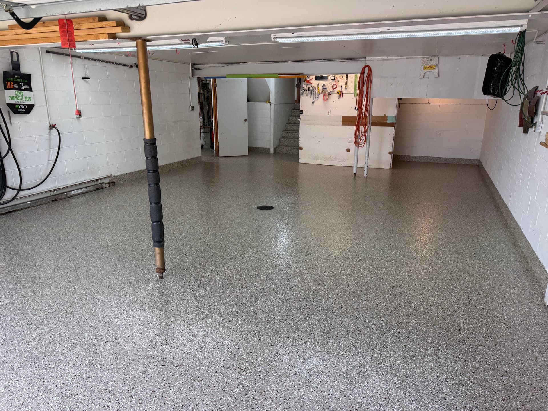 Creekbed Flake Floor System Covers a 2-Stall Garage and Sunroom