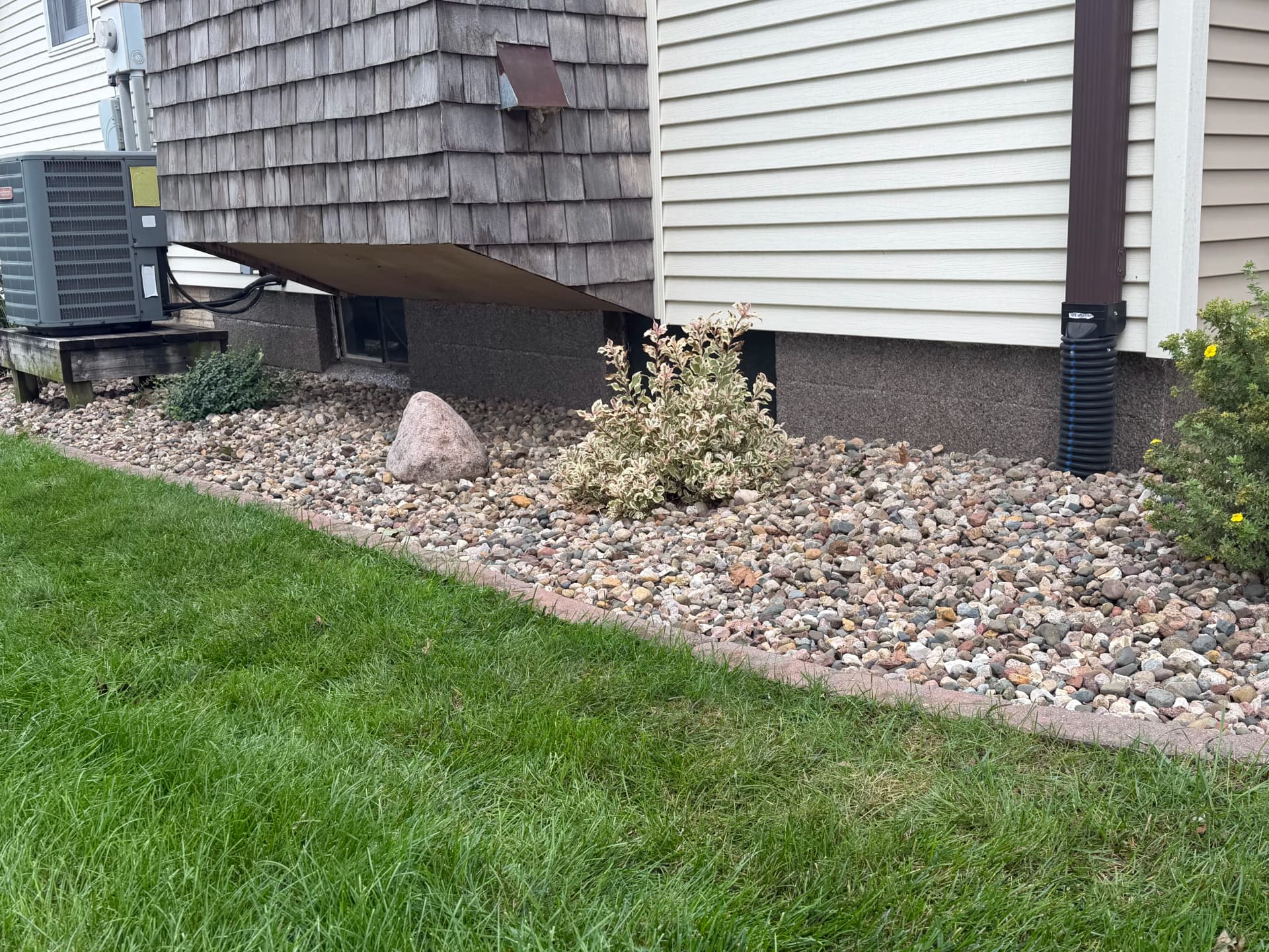 Garnet Flake Polyaspartic Coating on a Home Foundation Wall image