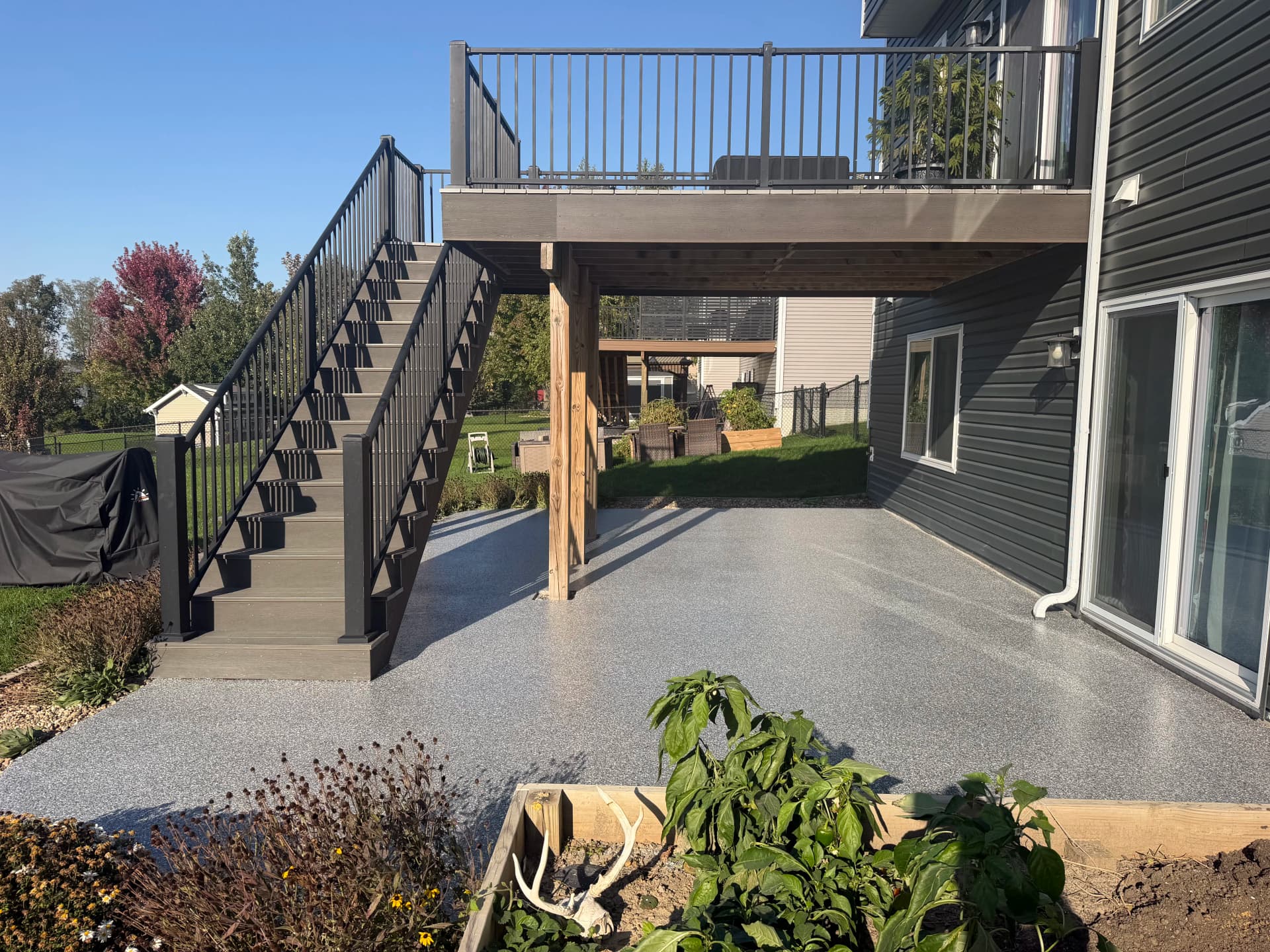 Outdoor Flake Floor System in Weathered Grey Upgrades Backyard Patio