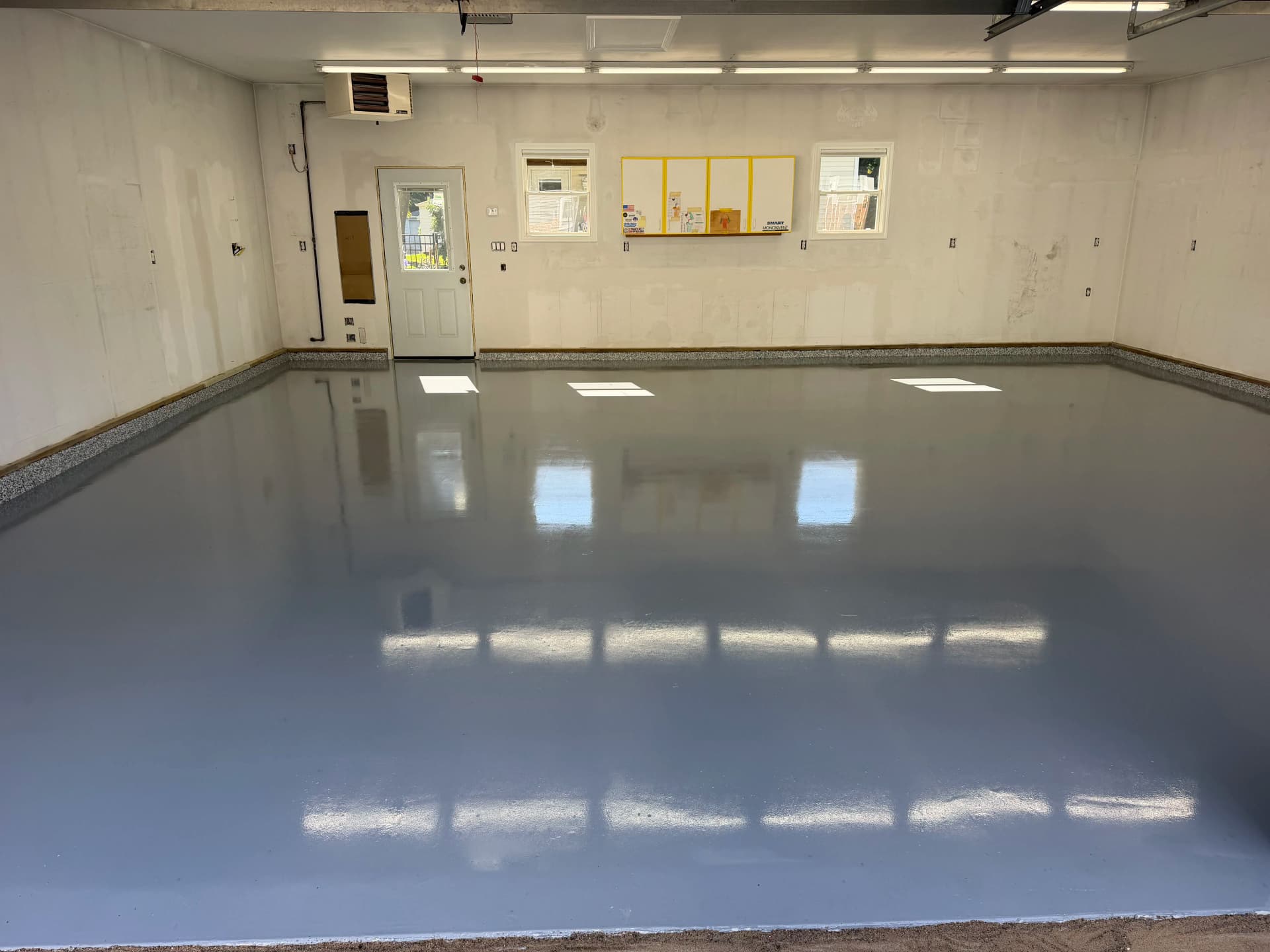 Gray Epoxy Garage Floor with Flaked Stem Walls Done Right