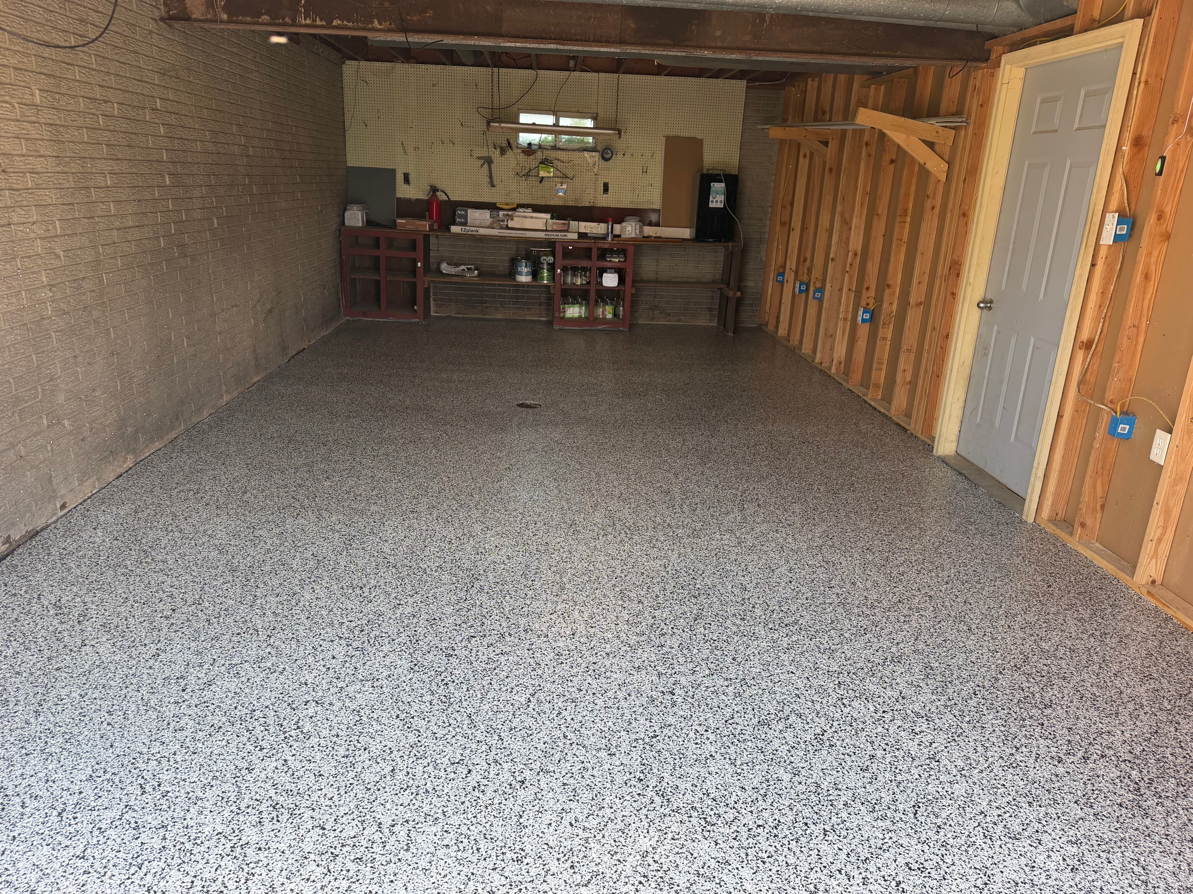 Project Epoxy Flake Floors Installed in a Basement and Garage image