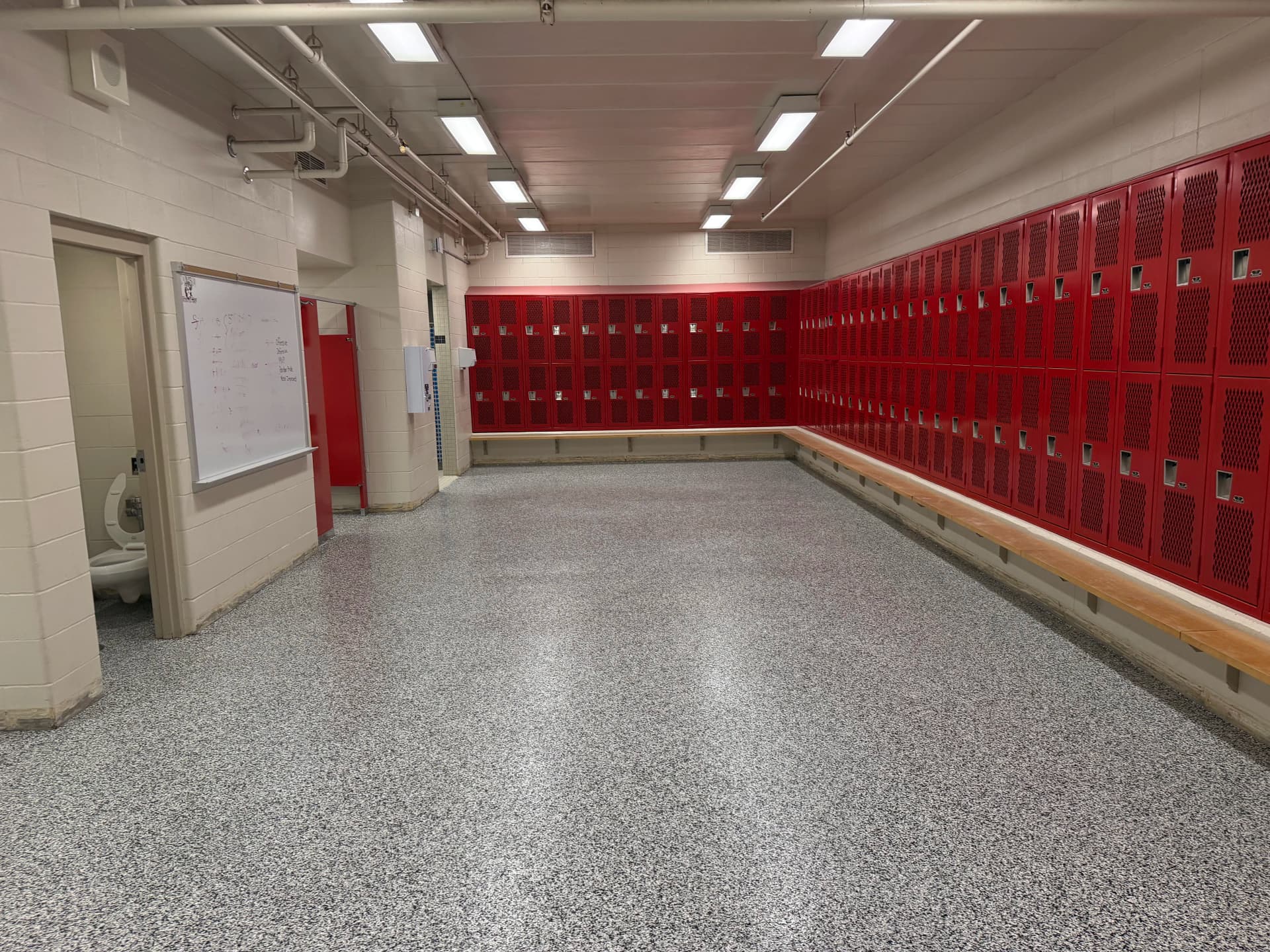 Gallery photos for Monticello High School Locker Rooms Get a Heavy-Duty Flake Floor: Image #1